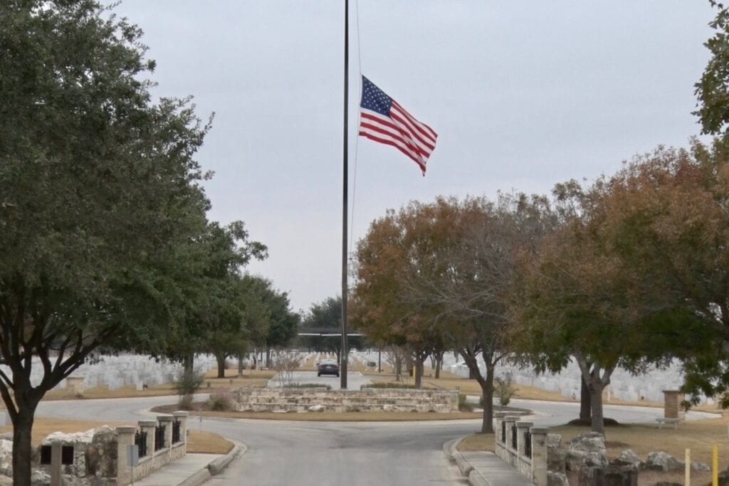 USA Flag been uplifted on a flag pole