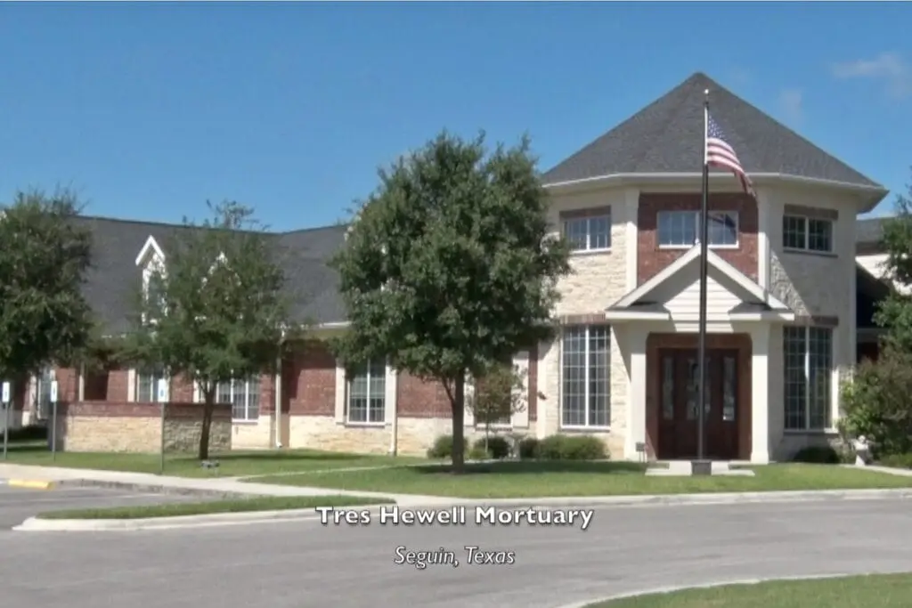 Tres Hewell Mortuary Texas office with a USA flag